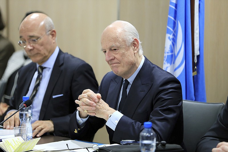 
              UN Special Envoy for Syria Staffan de Mistura, right, attends a meeting of Intra-Syria peace talks with Syrian government delegation at Palais des Nations in Geneva, Switzerland, Saturday, Feb. 25, 2017. (Pierre Albouy/Pool Photo via AP)
            