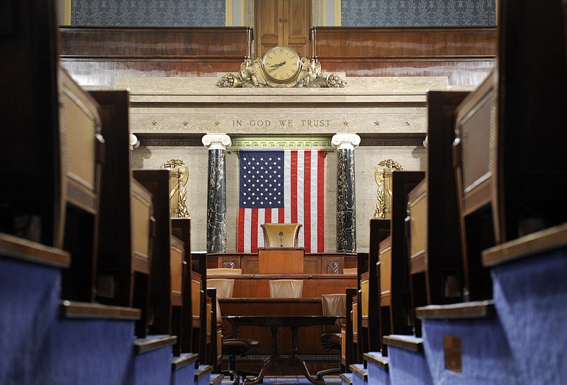 FILE - This Dec. 8, 2008, file photo shows the House Chamber on Capitol Hill in Washington. A presidential speech to Congress is one of those all-American moments that ooze ritual and decorum. The House sergeant-at-arms will stand at the rear of the House of Representatives on Tuesday night and announce the arrival of Donald Trump before a joint session of Congress by intoning: "Mister Speaker, the President of the United States" just like always. (AP Photo/Susan Walsh, File)