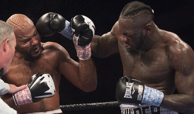 
              Deontay Wilder, right, throws a right at Gerald Washington during the WBC heavyweight title boxing bout Saturday, Feb. 25, 2017, in Birmingham, Ala. Wilder defeated Washington in the fifth round. (Albert Cesare/The Montgomery Advertiser via AP)
            