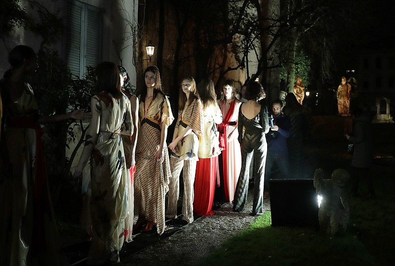 
              Models wait to go on the catwalk as they wear creations for Vionnet women's Fall-Winter 2017-2018 collection, part of the Milan Fashion Week, unveiled in Milan, Italy, Friday, Feb. 24, 2017. (AP Photo/Antonio Calanni)
            