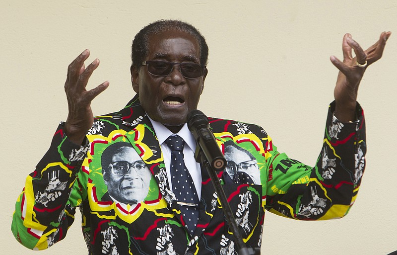 
              FILE - In this Dec, 17, 2016, file photo, Zimbabwean President Robert Mugabe addresses people at an event before the closure of his party's 16th Annual Peoples Conference in Masvingo, south of Harare. Zimbabwe. Mugabe is celebrating his 93rd birthday on Saturday, Feb. 25, 2017 amid granite hills where ancient spirits are said to dwell, defying calls to resign after nearly four decades in power in a region known for opposing a leader who says he’ll run again in 2018 elections. (AP Photo/Tsvangirayi Mukwazhi, File)
            