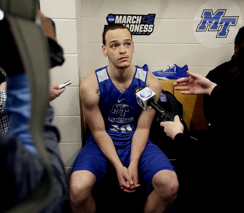 Middle Tennessee's Reggie Upshaw is interviewed in the locker room before practice for a second-round men's college basketball game in the NCAA Tournament, Saturday, March 19, 2016, in St. Louis. Middle Tennessee plays Syracuse on Sunday. (AP Photo/Charlie Riedel)