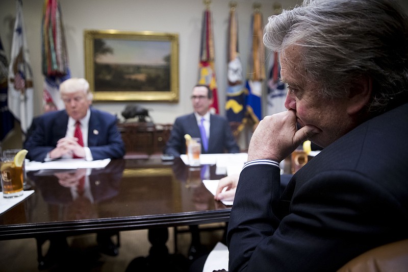 Adviser Steve Bannon looks on as President Donald Trump speaks at a working lunch to discuss the federal budget, at the White House in Washington last Wednesday.