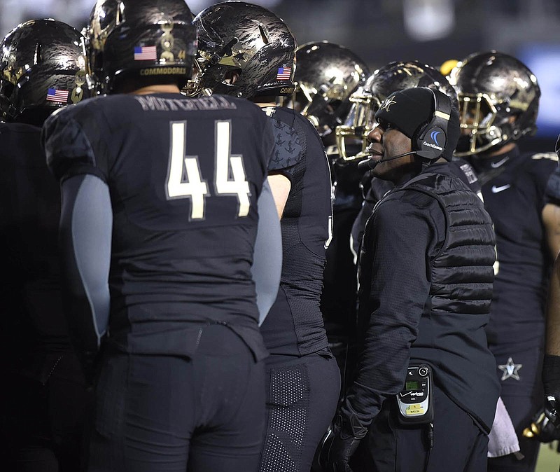 Vanderbilt coach Derek Mason, right, talks to his players during last season's home win against Tennessee. Mason also led the Commodores to victories against Georgia and Ole Miss in his third season in charge of the program.