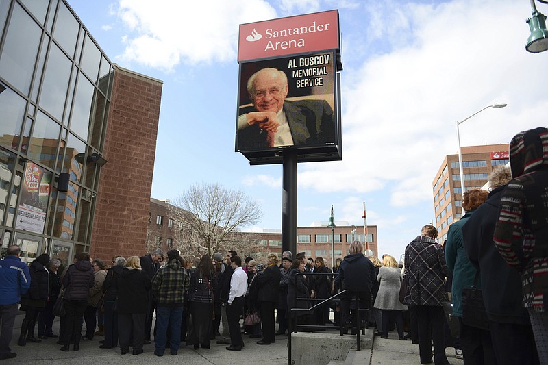 
              People wait to enter the memorial service for Albert Boscov at the Santander Arena, Sunday, Feb. 26, 2017 in Reading, Pa.  Late department store chairman Albert Boscov was remembered as an energetic businessman, a caring person and a tireless cheerleader for the city he loved.Hundreds gathered Sunday at a Reading arena to honor Boscov, who died Feb. 10 at age 87, and who was credited with driving the growth of the century-old business established by his father to sales in excess of $1 billion.
(Lauren A. Little/Reading Eagle via AP)
            