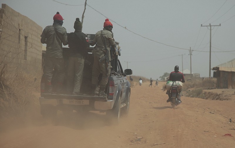 
              Security officers patrol the area near to the site where gunmen abducted German archaeologists professor Peter Breunig and his associate Johannes Behringer in Janjala Village, Nigeria. Friday, Feb. 24, 2017.  Kidnappers are demanding a ransom of 60 million naira (about Dlrs 200,000 US) for the two captives abducted this week from Janjala village in northern Nigeria, the excavation site where the German archaeologists was working. Two villagers were shot and killed in the kidnapping, police confirmed Friday. (AP Photo/Lekan Oyekanmi )
            