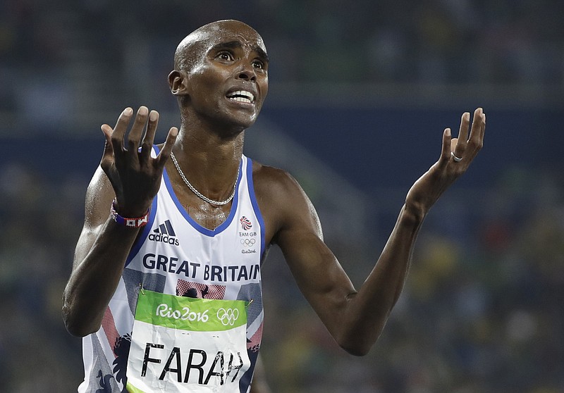 
              FILE- In this Saturday, Aug. 20, 2016 file photo, Britain's Mo Farah celebrates winning the gold medal in the men's 5000-meter final during the athletics competitions of the 2016 Summer Olympics at the Olympic stadium in Rio de Janeiro, Brazil. Quadruple Olympic champion Mo Farah maintained Sunday, Feb. 26, 2017, that he has always competed cleanly and never broken anti-doping rules, countering any association with "allegations of drug misuse." (AP Photo/David J. Phillip, File)
            