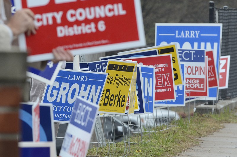 Campaign signs line East Brainerd Road in front of the polling place at Concord Baptist Church during the 2013 municipal election.