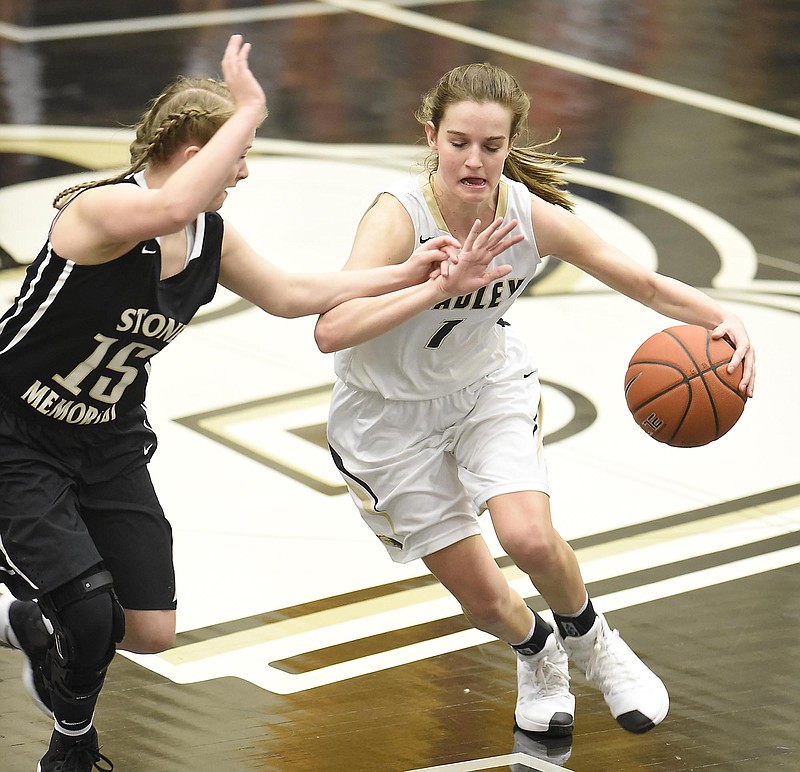 Bradley Central's Halle Hughes (1) dribbles around the defense of Stone Memorial's Paige Selby (15).   The Stone Memorial Panthers visited the Bradley Central Bears in the girls's Region 3-AAA semifinals on February 27, 2017.