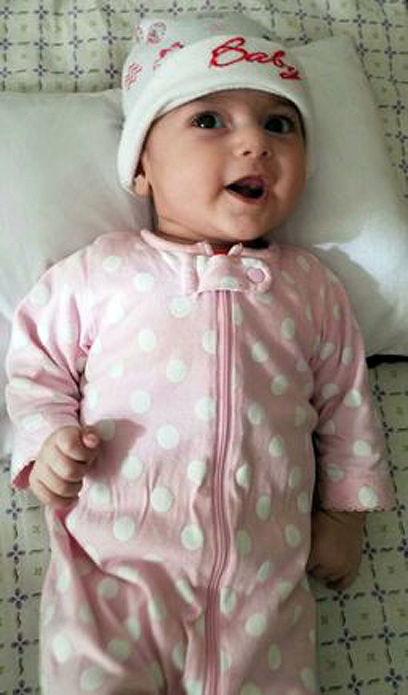 
              This undated photo shows Fatemeh Reshad, an infant from Iran, who was recently treated for a life-threatening heart condition at Oregon Health Sciences University's Doernbecher Children's Hospital in Portland, Ore. The 4-month-old infant was flown to Portland for her life-saving heart surgery after she was temporarily banned from coming into the U.S. by President Donald Trump's travel ban. Physicians said Monday, Feb. 27, 2017, the girl is "out of the woods" and making good progress after her life-saving surgery. (Family photo/OHSU Doernbecher Children's Hospital via AP)
            