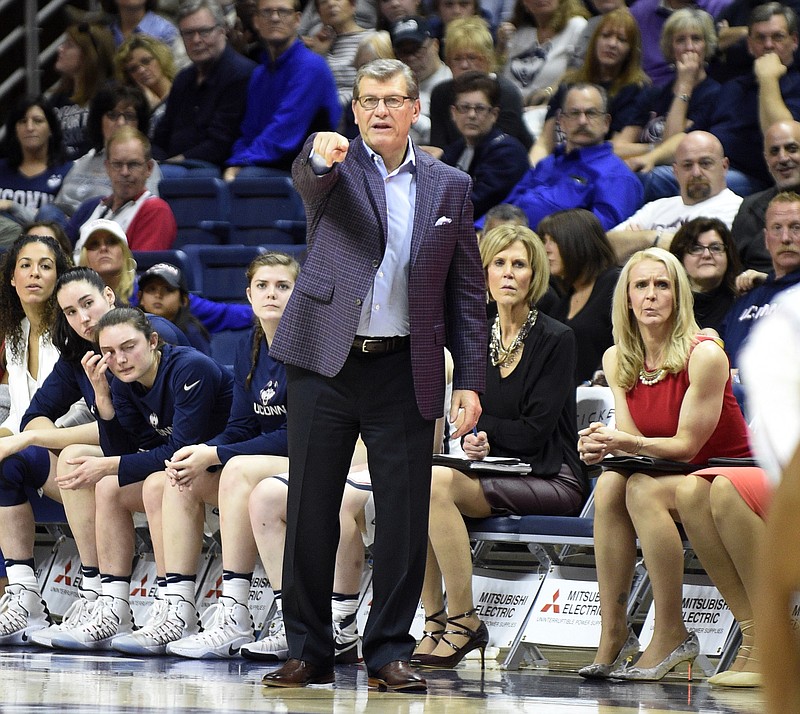 
              Connecticut coach Geno Auriemma signals to his team during the first half of Connecticut's 91-48 victory over Memphis in an NCAA college basketball game in Storrs, Conn., Saturday, Feb. 25, 2017. (AP Photo/Fred Beckham)
            