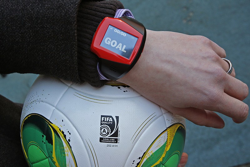 
              FILE - The Dec. 8, 2012 file photo shows a referee's watch with the goal as they demonstrate the goal-line technology of Hawk-Eye system at Toyota stadium in Toyota. After PSV Eindhoven goalkeeper Jeroen Zoet made the save, he made a costly mistake on Sunday Feb. 26, 2017. Zoet saved a close-range header from Feyenoord defender Jan-Arie van der Heijden, but as he clutched the ball to his chest, a screen on referee Bas Nijhuis' wrist lit up. Nijhuis looked down, saw the word "goal" flashing on the screen and awarded the Dutch league leaders the winning score in a 2-1 victory. (AP Photo/Shuji Kajiyama/File)
            