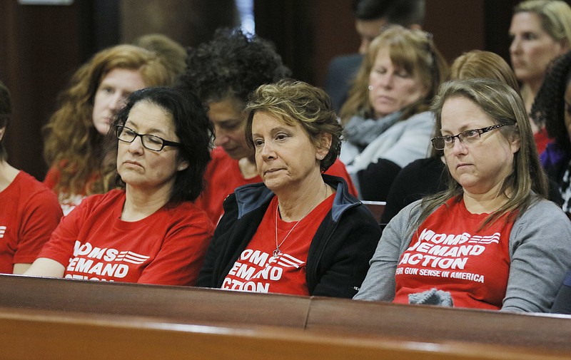 
              Woman from the group Moms Demand Action watch as the campus Carry bill advances Monday, Feb. 27, 2017, at the legislature in Atlanta. With little fanfare, the House Public Safety and Homeland Security Committee om Monday approved what has become known as the "Campus Carry" bill. Ballinger is the sponsor of HB 280, which allows anyone with a Georgia weapons permit to carry firearms onto most parts of public college and university campuses.  (Bob Andres/Atlanta Journal-Constitution via AP)
            