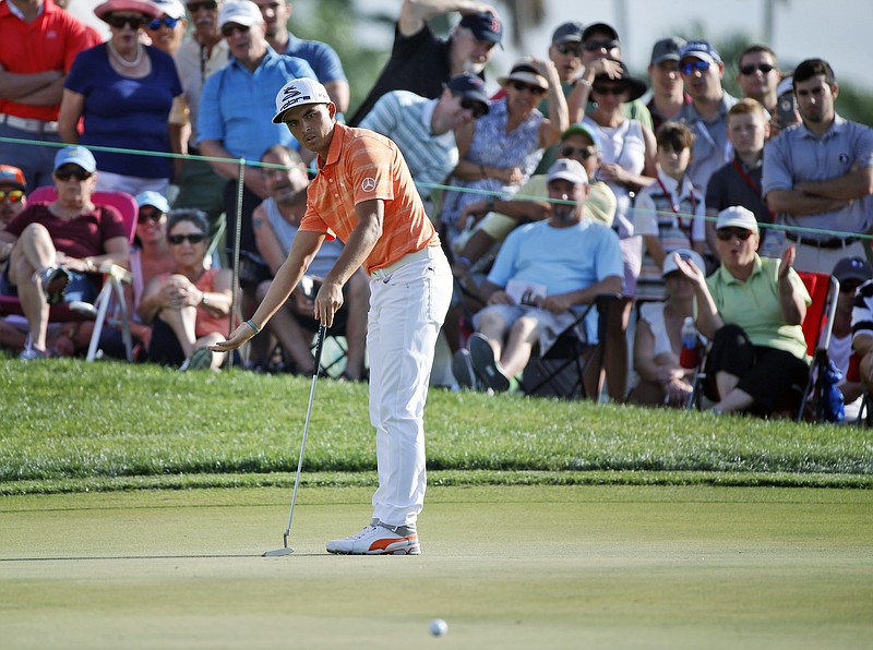 
              Rickie Fowler reacts as he watches his putt on the 12th hole during the final round of the Honda Classic golf tournament, Sunday, Feb. 26, 2017, in Palm Beach Gardens, Fla. Fowler won the tournament. (AP Photo/Wilfredo Lee)
            