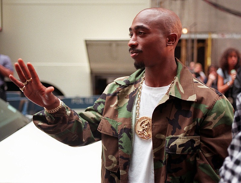 
              FILE - In this Sept. 4, 1996, file photo, rapper Tupac Shakur arrives at New York's Radio City Music Hall three days before being fatally shot in Las Vegas. The car in which Shakur was shot was listed for sale for $1.5 million on Feb. 21, 2017, by a California memorabilia dealer. (AP Photo/Todd Plitt, File)
            