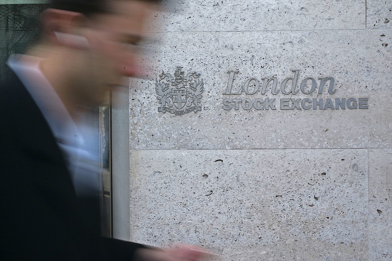 
              FILE- In this Monday, March 17, 2008 file photo, a man walks past the London Stock Exchange in the City of London. The London Stock Exchange says its planned merger with the Deutsche Boerse is likely to be blocked after the European Commission raised anti-trust concerns. (AP Photo/Sang Tan, File)
            