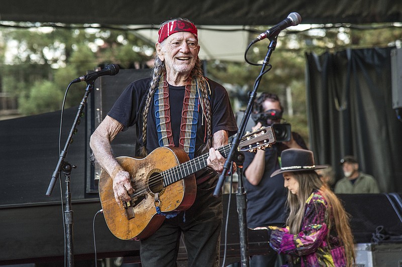 
              FILE - This Oct. 23, 2016 file photo shows country legend Willie Nelson performing at the 30th Annual Bridge School Benefit Concert in Mountain View, Calif. Fellow country singer Merle Haggard will be honored a year after his death with an all-star concert featuring his longtime friend and duet partner Willie Nelson as well as Kenny Chesney, Miranda Lambert and John Mellencamp. Haggard died of pneumonia on April 6, 2016, in Palo Cedro at the age of 79. (Photo by Amy Harris/Invision/AP)
            