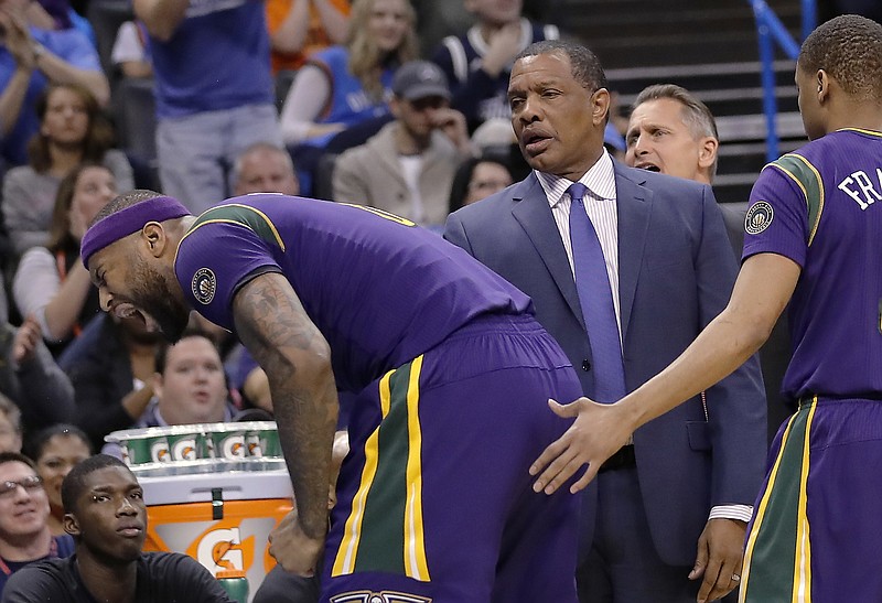 
              New Orleans Pelicans forward DeMarcus Cousins (0) reacts after fouling out as New Orleans Pelicans head coach Alvin Gentry looks on during the second half of an NBA basketball game in Oklahoma City, Sunday, Feb. 26, 2017. Oklahoma City won 118-110. (AP Photo/Alonzo Adams)
            