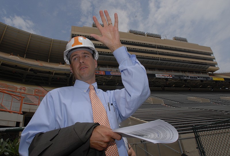 SPTS --  John Currie, University of Tennessee Sr. Associate Athletic Director, helps lead a media tour of Neyland Stadium renovations, Monday. Behind him is the new East Side Club which seats will secure $22 million in funding for renovations. 
6/19/2006
Photo by Clay Owen/News Sentinel.