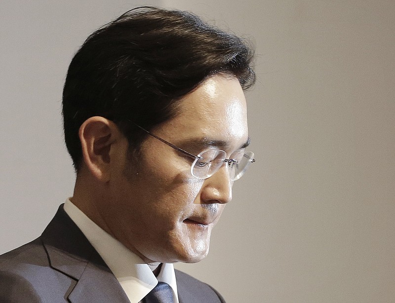 
              FILE - In this Tuesday, June 23, 2015, file photo, Lee Jae-yong, vice president of Samsung Electronics Co., bites his lips during a press conference at the company's headquarters in Seoul, South Korea. South Korean prosecutors say they will indict Lee on bribery, embezzlement and other charges linked to a political scandal that has toppled President Park Geun-hye. (AP Photo/Ahn Young-joon, File)
            