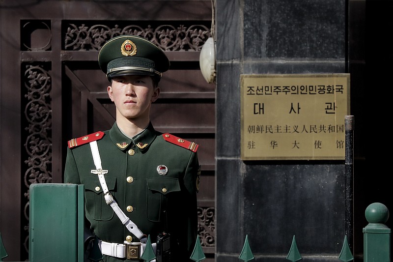 
              A Chinese paramilitary policeman stands guard outside the North Korea Embassy in Beijing, Tuesday, Feb. 28, 2017. A top North Korean diplomat is visiting Beijing in the wake of China's ban on coal imports from its neighbor and the assassination of North Korean leader Kim Jong Un's older half-brother in Malaysia. (AP Photo/Andy Wong)
            