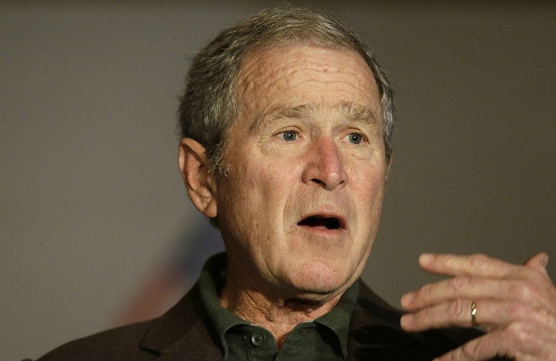 
              Former President George W Bush speaks during a preview of an exhibition of his paintings of U.S. military veterans in Dallas, Tuesday, Feb. 28, 2017. President Bush says he didn't intend to criticize President Donald Trump when he said recently that a free press is essential to democracy. (AP Photo/LM Otero)
            