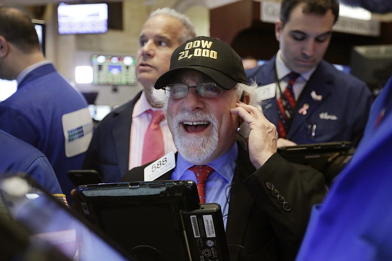 
              Trader Peter Tuchman wears a "Dow 21,000" hat as he works on the floor of the New York Stock Exchange, Wednesday, March 1, 2017. Stocks opened strongly higher on Wall Street, led by big gains in banks as investors expected interest rates to rise. The early jump Wednesday put the Dow Jones industrial average above 21,000 points for the first time. (AP Photo/Richard Drew)
            