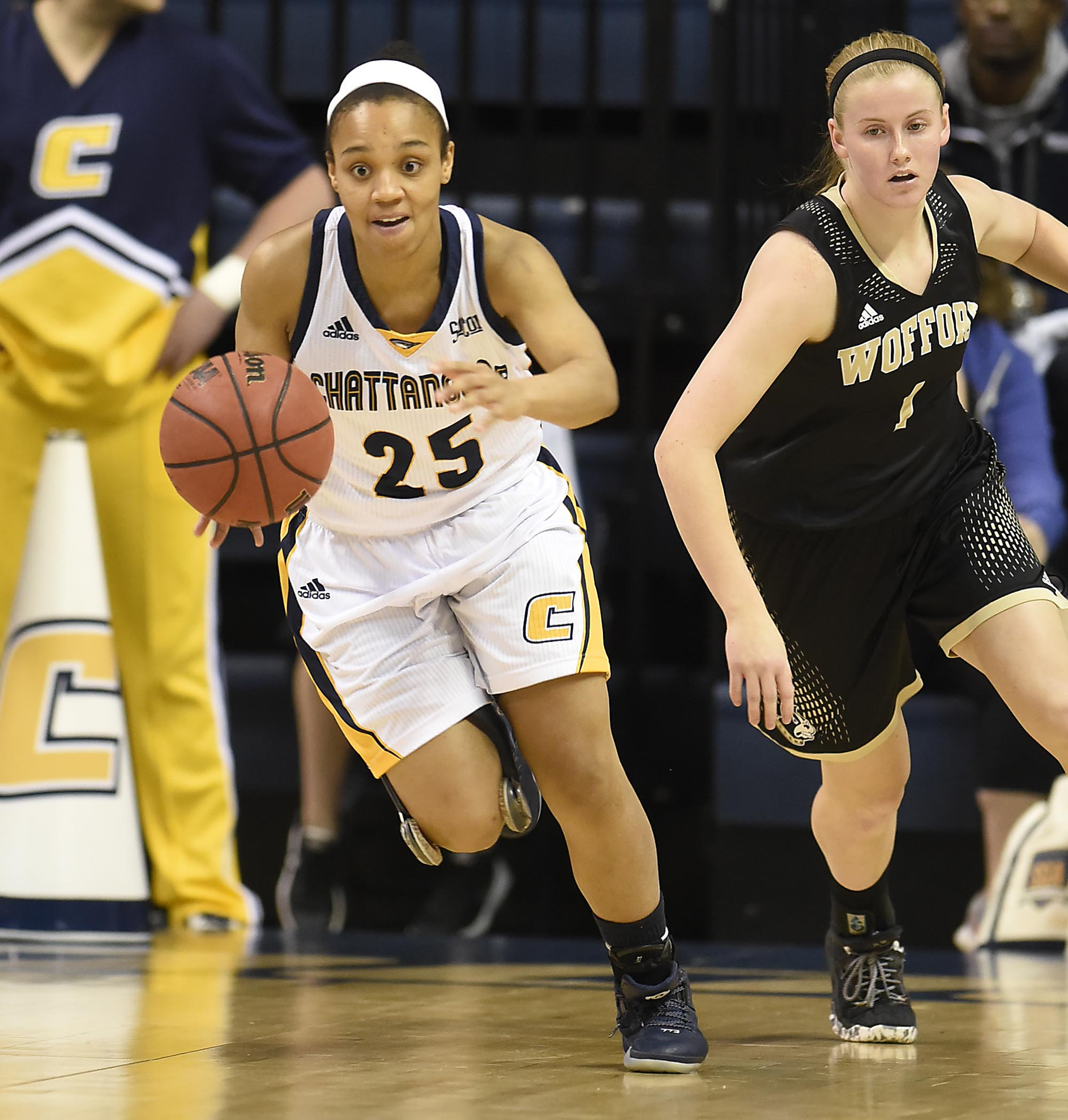 UTC's Chelsey Shumpert (25) brings the ball upcourt past Wofford's Chloe Wanink (1). The Wofford Terriers visited the Chattanooga Mocs in Southern Conference Basketball action at McKenzie Arena on February 25, 2017.