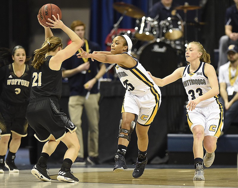 UTC's Chesley Shumpert, center, and Lakelyn Bouldin, right, close in on Wofford's Maria Corella during Saturday's SoCon matchup at McKenzie Arena. The Mocs won 76-56 to close the regular season on a three-game winning streak. They're seeded No. 1 for the SoCon tournament that starts today in Asheville, N.C.