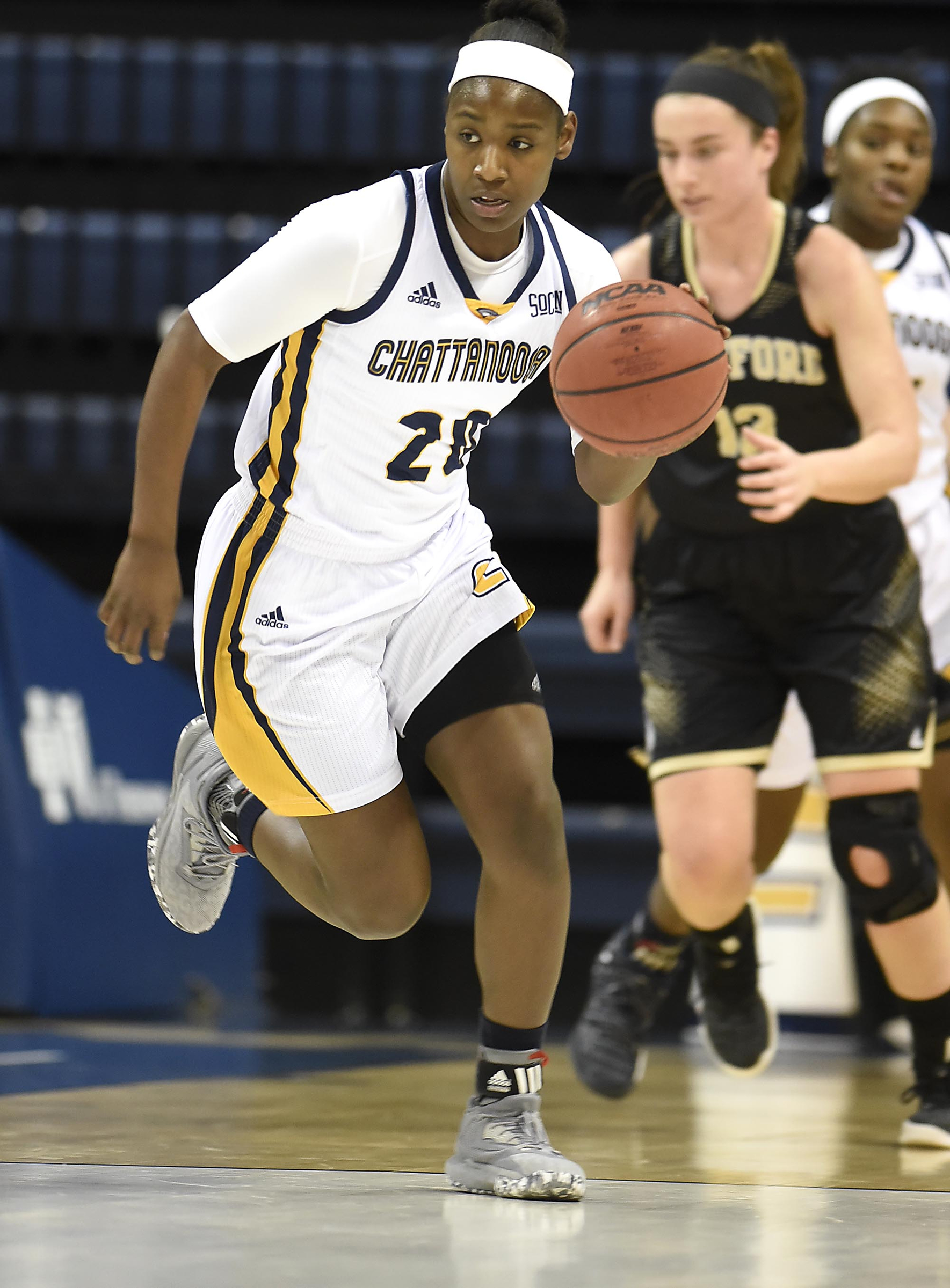 UTC's Keiana Gilbert brings the ball up the court during Saturday's game against Wofford at McKenzie Arena. The Mocs have a bid to the NIT if they don't win the SoCon tournament to earn an NCAA tournament berth, but Gilbert said the top-seeded Mocs are confident about their abilities entering today's game against Western Carolina.