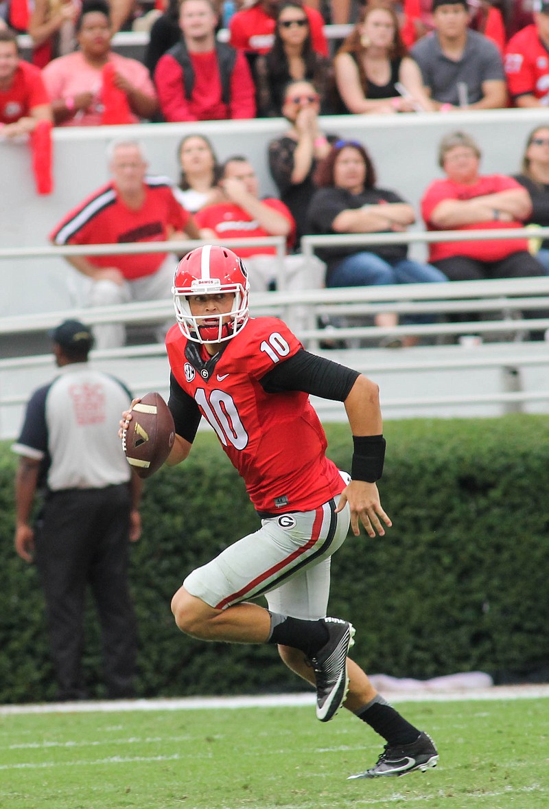 Georgia quarterback Jacob Eason had some of his longest pass plays last season after scrambling out of the pocket.