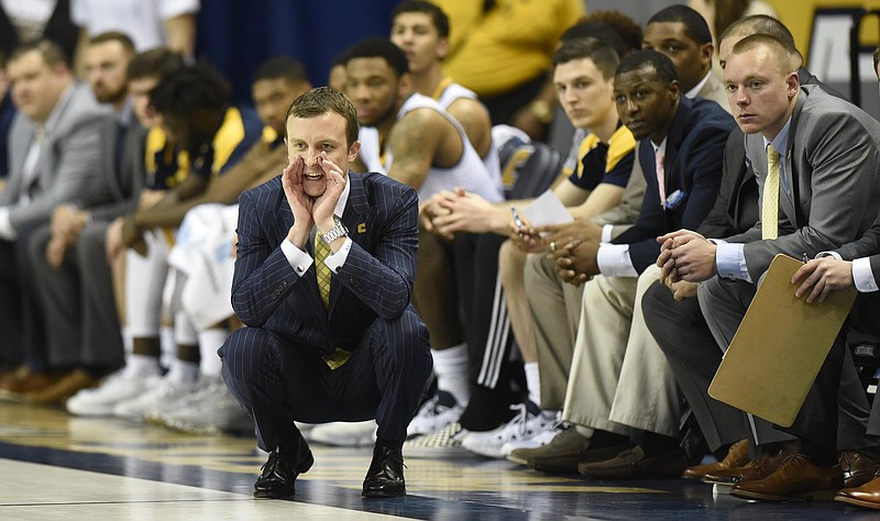 UTC head coach Matt McCall yells instructions to his team.  The Mercer Bears Chattanooga Mocs in Southern Conference Basketball action at McKenzie Arena on February 25, 2017.