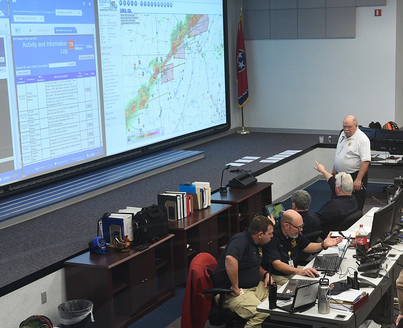 A team of agencies including police and fire departments, Homeland Security, TEMA, Salvation Army and others monitor the storm's progress Wednesday, March 1, 2017 in the 911 call center building on Amnicola Highway.