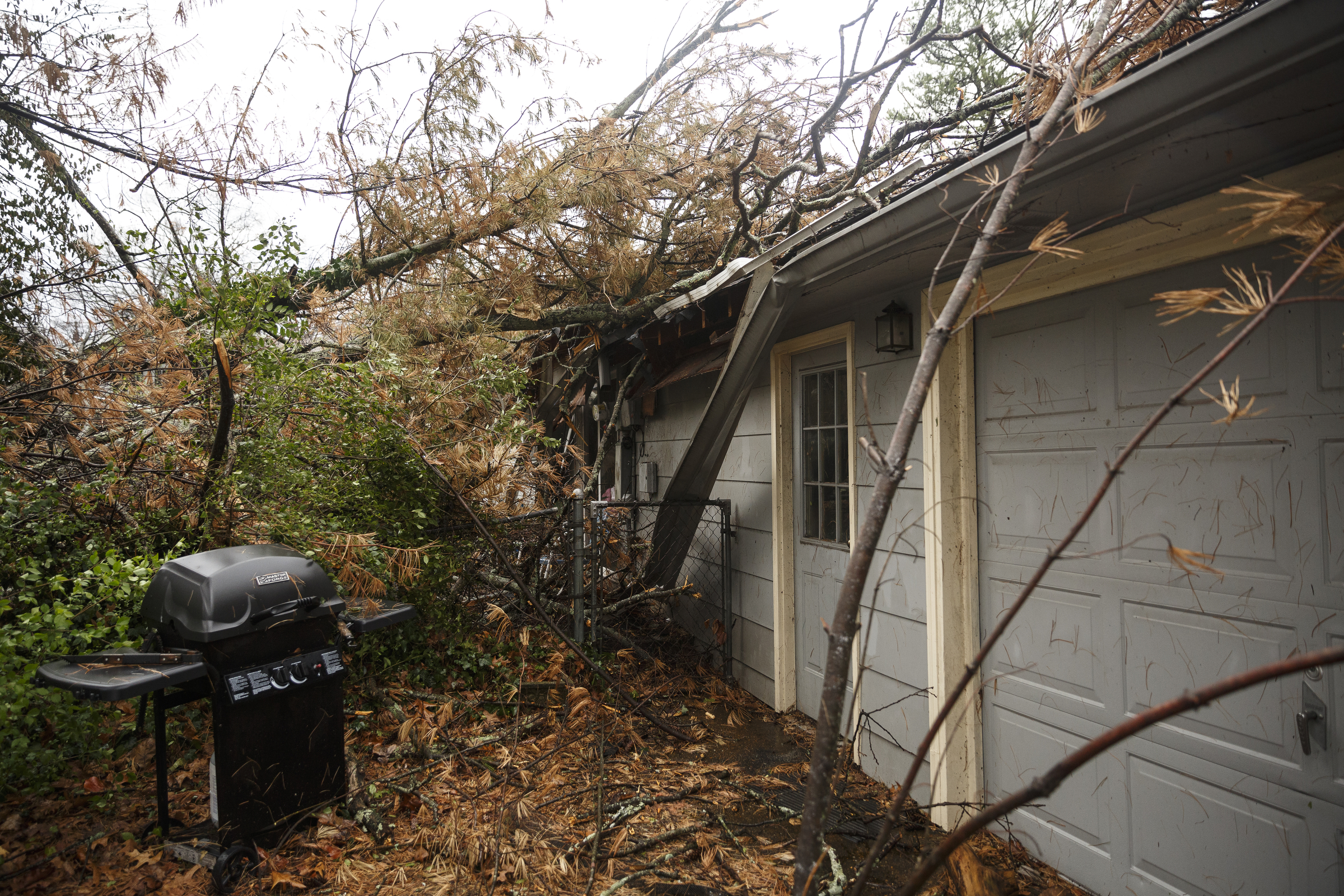 A tree fell on a home between Westwood Avenue and Highland Drive on Wednesday, March 1, 2017, in Chattanooga, Tenn. Severe storms swept through the region Wednesday afternoon.