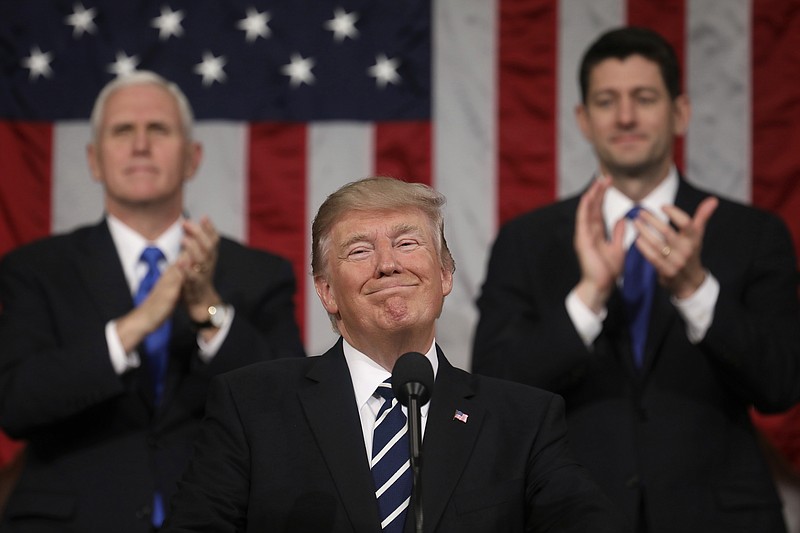 
              President Donald Trump addresses a joint session of Congress on Capitol Hill in Washington, Tuesday, Feb. 28, 2017, as Vice President Mike Pence and House Speaker Paul Ryan of Wis., applaud. (Jim Lo Scalzo/Pool Image via AP)
            
