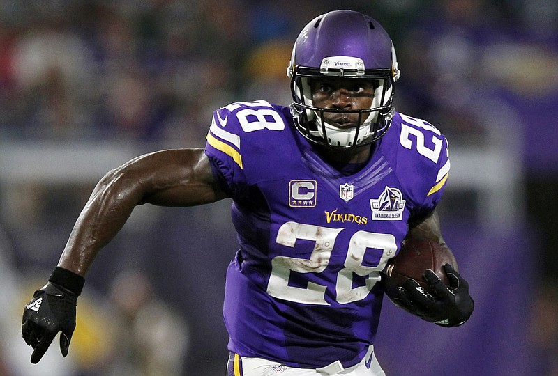 
              FILE - In this Sept. 18, 2016, file photo, Minnesota Vikings running back Adrian Peterson carries the ball during the first half of an NFL football game against the Green Bay Packers in Minneapolis. The Vikings on Tuesday, Feb. 28, 2017. have declined to exercise their option for next season on Peterson’s contract. This makes the franchise’s all-time leading rusher an unrestricted free agent when the market opens next week. (AP Photo/Andy Clayton-King, File)
            