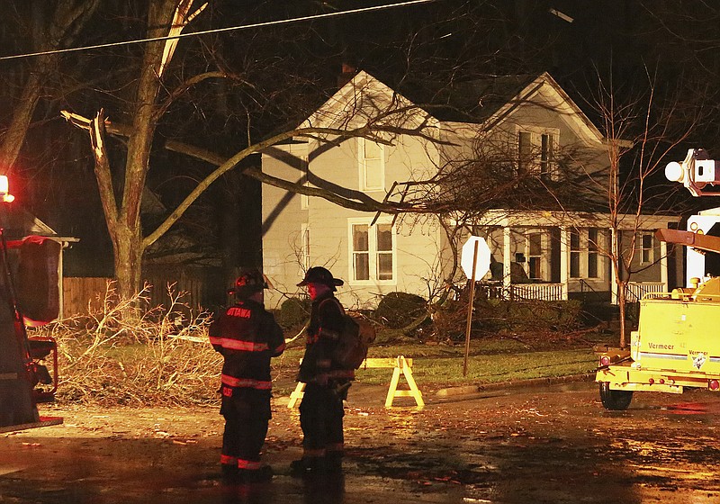 Firefighters work the site of a damaged area in Ottawa, Ill., after a tornado moved through the area Tuesday, Feb. 28, 2017. Illinois Gov. Bruce Rauner has activated the state's emergency operations center as local officials reported damage from tornados spawned by a late-winter storm system. (Allen Cunningham/Chicago Sun-Times via AP)