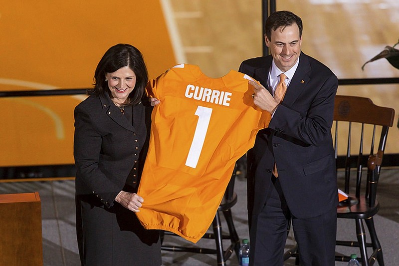 University of Tennessee chancellor Beverly Devenport welcomes John Currie as the school's new vice chancellor and athletic director during an introduction ceremony Thursday at Thompson-Boling Arena in Knoxville.