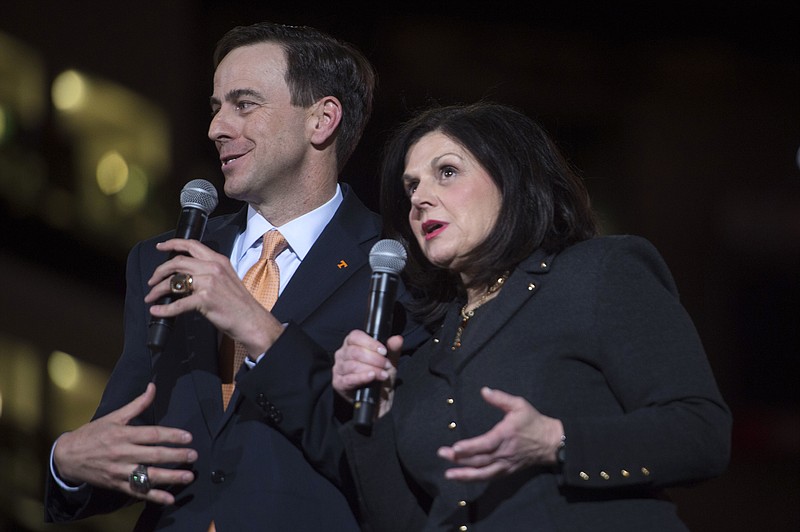 New Tennessee athletic director John Currie and school chancellor Beverly Davenport speak on stage in Thompson-Boling Arena on Thursday during a ceremony introducing Currie. He previously worked at Tennessee in the No. 2 role in the athletic department and comes back to Knoxville after serving as Kansas State's AD since 2009.