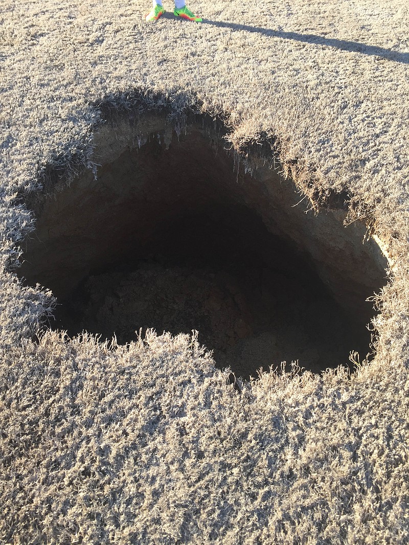 The opening of a sinkhole approximately 15 feet deep and six feet wide on Soddy-Daisy's soccer field means the Trojans must play home games elsewhere for a while.