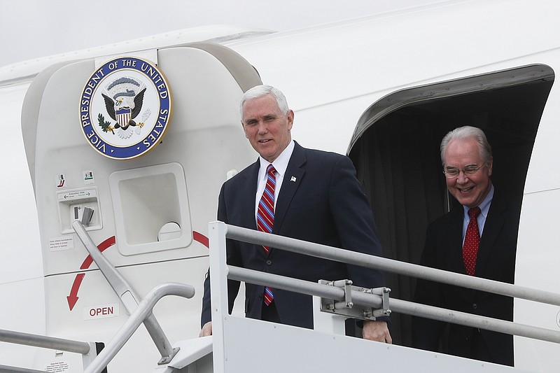 
              Vice President Mike Pence, left, and Health and Human Services Secretary Tom Price arrive at Cincinnati/Northern Kentucky International Airport, Thursday, March 2, 2017, in Burlington, Ky. Pence visited Ohio to discuss healthcare and other issues while engaging in a "listening session" with small business owners (AP Photo/John Minchillo)
            