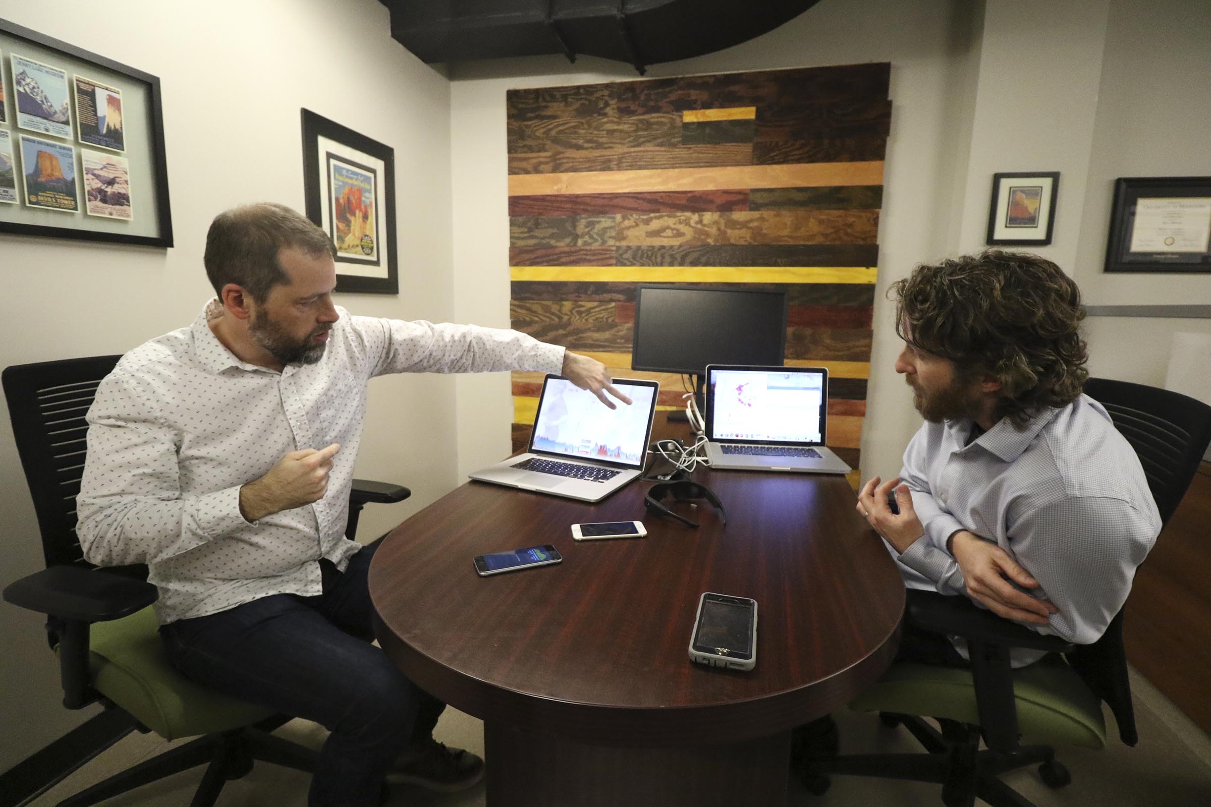 Staff Photo by Dan Henry / The Chattanooga Times Free Press- 2/23/17. Alex Cruikshank, left, and Dr. Andrew Bailey speak about a brain-monitoring program that are using EMOTIV headsets to livestream athletes brainwaves.