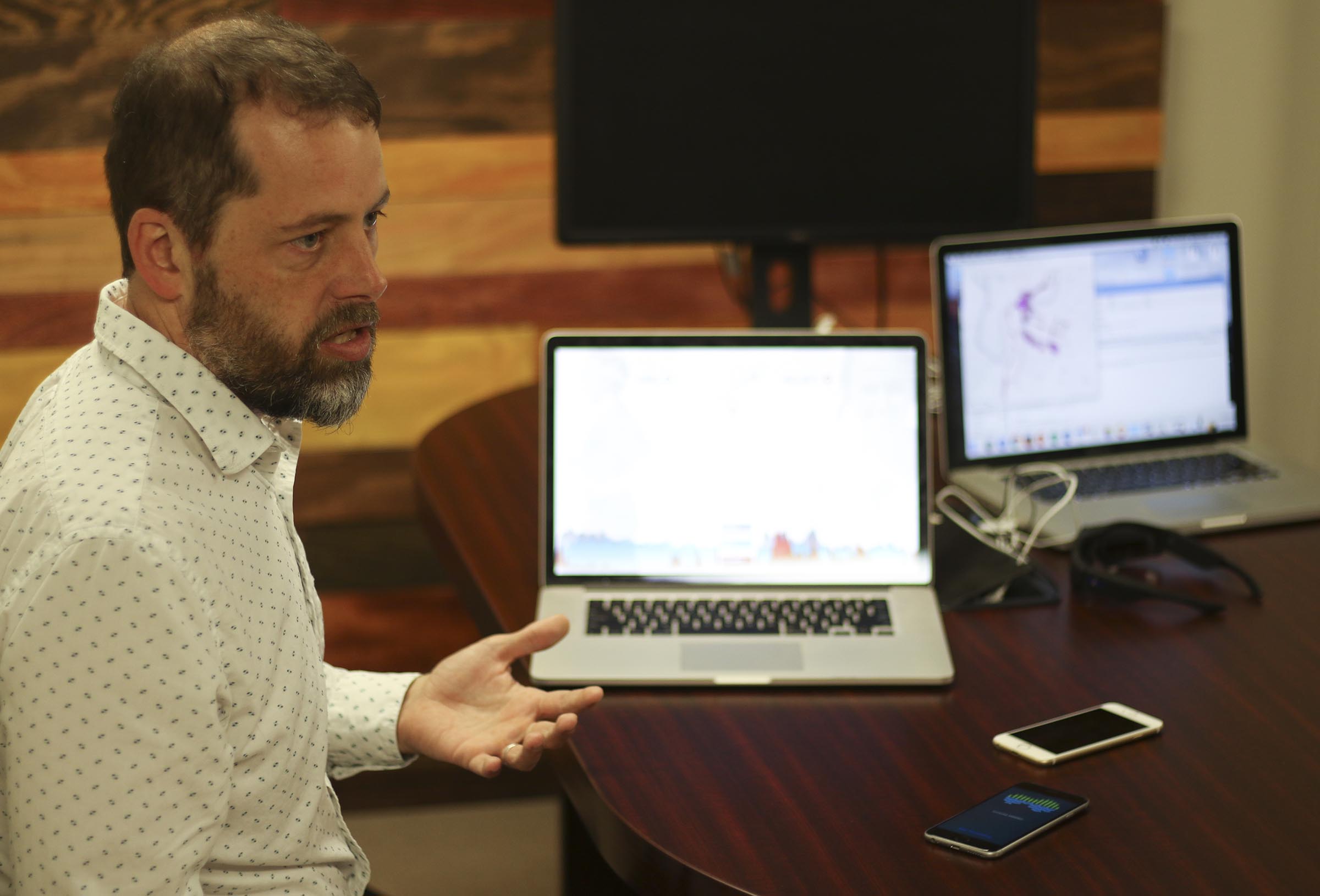 Staff Photo by Dan Henry / The Chattanooga Times Free Press- 2/23/17. Alex Cruikshank, left, and Dr. Andrew Bailey (not pictured) speak about a brain-monitoring program that are using EMOTIV headsets to livestream athletes brainwaves.