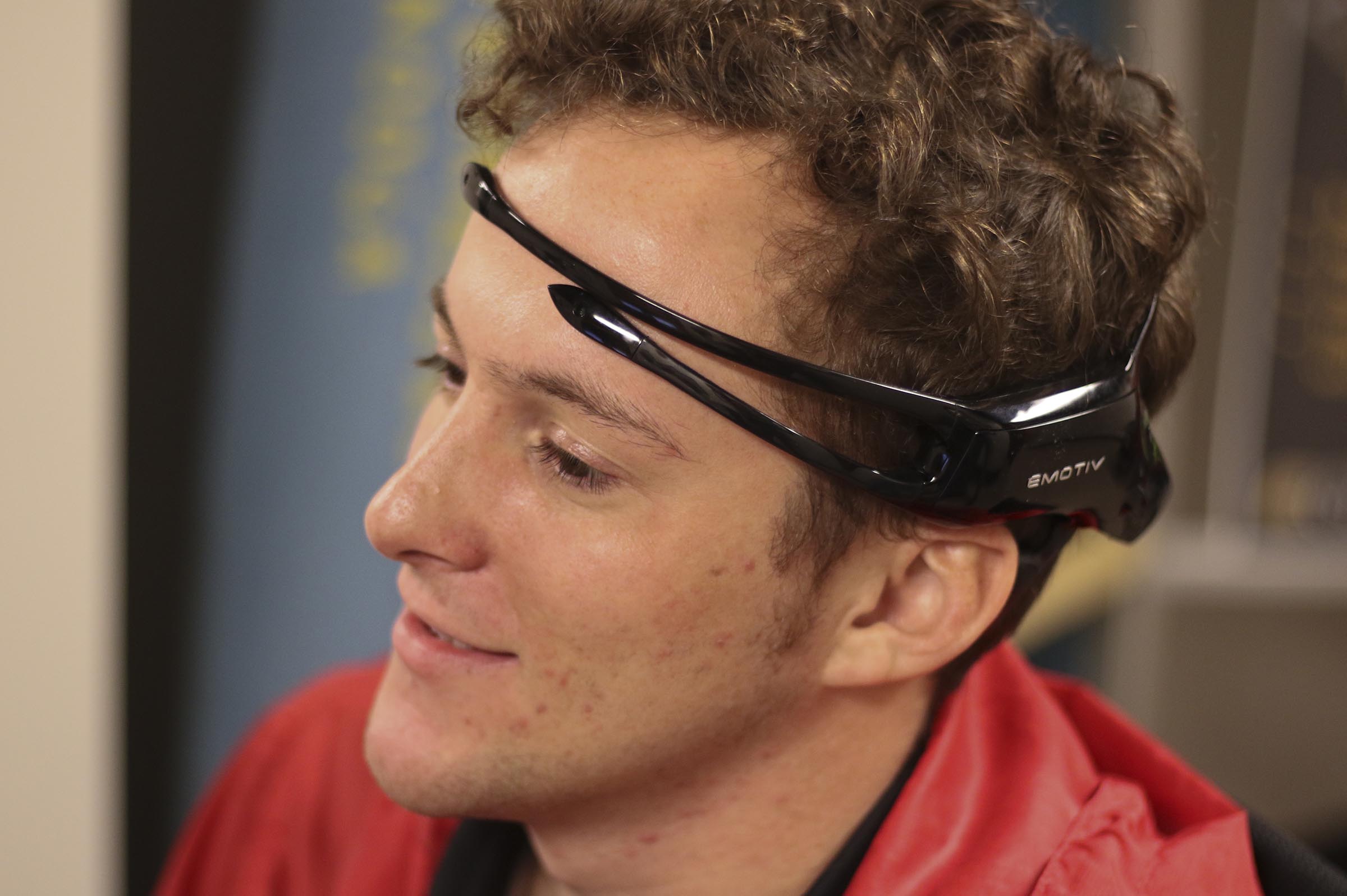 Staff Photo by Dan Henry / The Chattanooga Times Free Press- 2/23/17. Reporter David Cobb listens as Alex Cruikshank and Dr. Andrew Bailey speak about a brain-monitoring program that are using EMOTIV headsets to livestream athletes brainwaves.