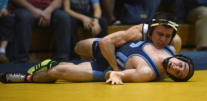 UTC's Chris DeBien and The Citadel's Andrew Szalwinski compete in the 133-pound weight class on Feb. 12 at Maclellan Gym. DeBien is a No. 1 seed in the Southern Conference tournament today in Charleston, S.C.