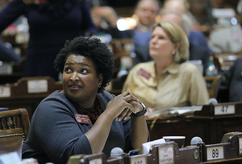 
              House Minority Leader Stacey Abrams, D-Atlanta, watches the votes come in as the House passes a bill Friday, March 3, 2017, in Atlanta. Legislative rules require bills to pass at least one chamber by the end of Friday to stay alive for the year. (Bob Andres/Atlanta Journal-Constitution via AP)
            