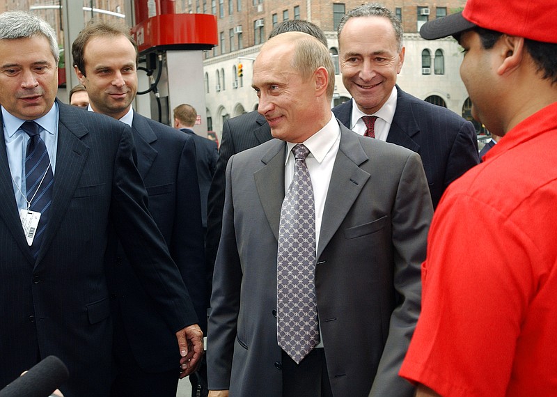 
              FILE - In this Sept. 26, 2003, file photo, Russian President Vladimir Putin, center, and Sen. Charles Schumer D-N.Y., second from right, are escorted through New York's first Lukoil gas station by Lukoil President Vagit Alekperov, left, in New York City. Lukoil is the giant Russian oil company. Putin later traveled to meet with President George W. Bush at the Camp David presidential retreat. President Donald Trump, his administration under siege for contacts with Russian officials, is calling for "an immediate investigation" into Schumer tie's to Russian Putin. Trump’s evidence? A 14-year-old photo of Schumer and Putin holding coffee and doughnuts in a New York City gas station. (AP Photo/Scout Tufankjian, File)
            