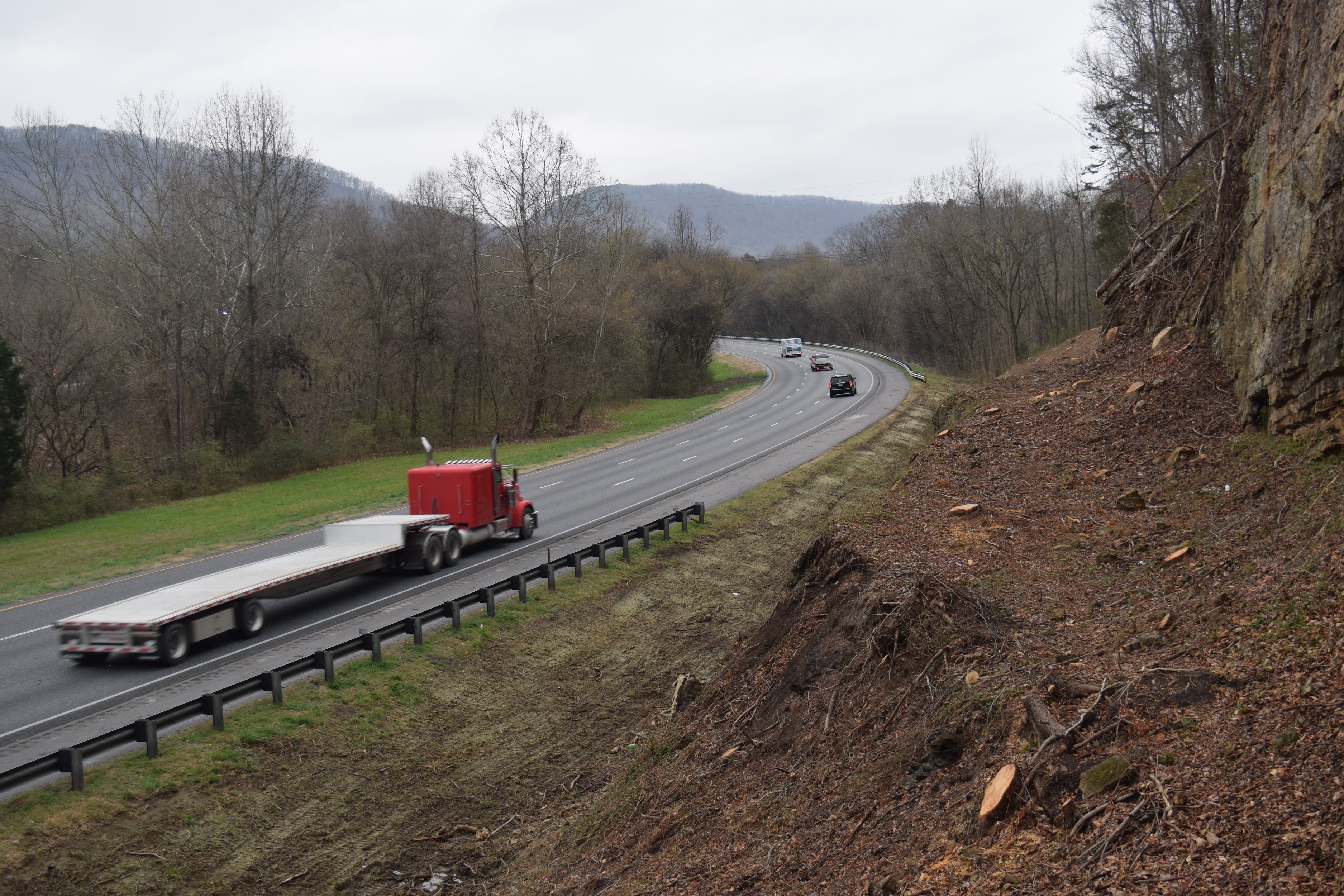 Georgia Department of Transportation crews have trimmed back the tree line on Intestate 24, west of Chattanooga where it runs through the Peach State for four miles along the Tennessee border. GDOT crews also are doing similar work on Interstate 59. The work is intended to enhance safety to improve driver visibility and response time. Here, tree stumps extend down almost to the drainage ditch, showing where the tree line was previously.