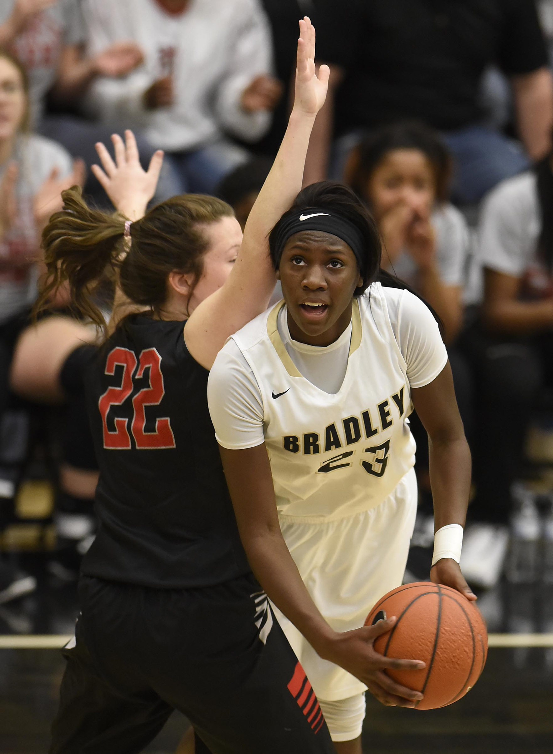 Bradley's Rhyne Howard (23) puts up a underhanded shot around Stewarts Creek's McCrary Morgan (22). The Stewarts Creek Red Hawks visited the Bradley Central Bears in TSSAA girls sub state basketball action on March 4, 2017.