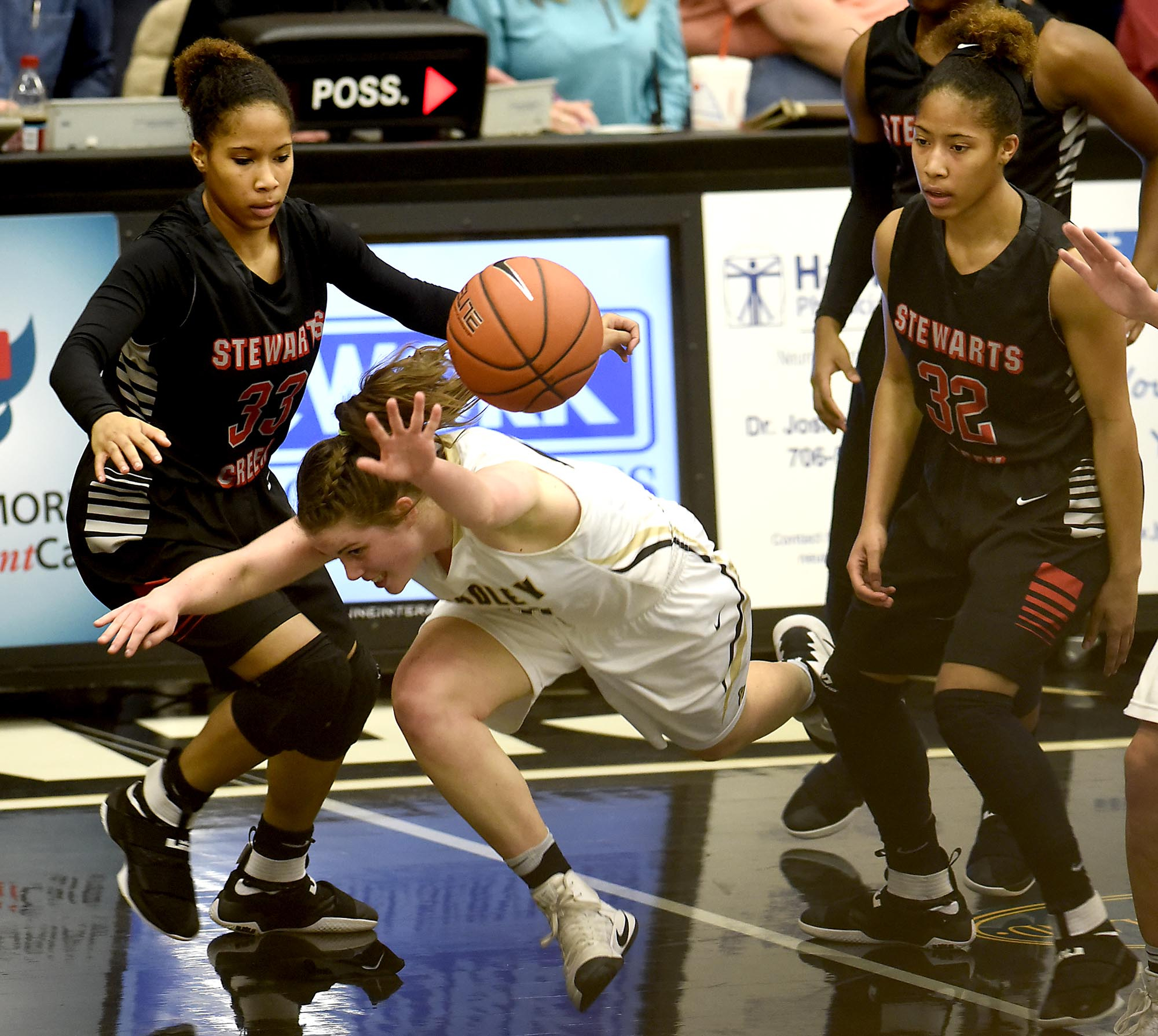 The defense of Stewart Creek's Brandi Ferby (33) and Brianah Ferby (22) cause Bradley's Emma Kate Brown (1) to turn the ball over. The Stewarts Creek Red Hawks visited the Bradley Central Bears in TSSAA girls sub state basketball action on March 4, 2017.